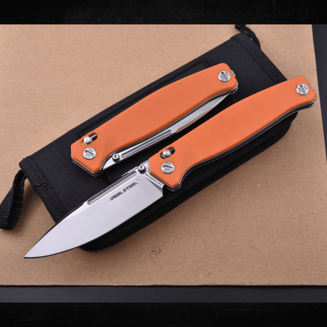 Real Steel Huginn Tactical Crossbar Lock Folding Knife -Black 3.66" VG-10 Blade, Milled Orange G10 Handle 7651OS 89.00 Real Steel Knives www.realsteelknives.com