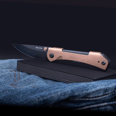 Real Steel SYLPH Liner Lock Folding Knife 3.15'' Nitro-V Black PVD Blade, Gold Stainless Steel Handle 7141GB 59.00 Real Steel Knives www.realsteelknives.com